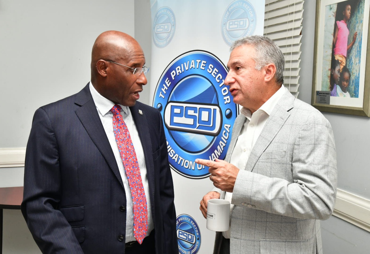 Minister of Industry, Investment and Commerce, Senator the Hon. Aubyn Hill (left), in discussion with Private Sector Organisation of Jamaica (PSOJ) President, Metry Seaga, during the PSOJ Partners’ Circle Meeting on Friday (August 23). The meeting was held at the PSOJ’s head office in Kingston.

