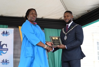 Mayor of Montego Bay and Chairman of the St. James Municipal Corporation, Councillor Richard Vernon, presents the Spirit of Independence Award to philanthropist  Janet Richards, Founder and President of the Janet Richards Foundation, during the St. James Independence Day civic ceremony at Sam Sharpe Square in Montego Bay on August 6.

