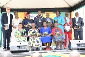 Mayor of Montego Bay, Councillor Richard Vernon (fourth left, back row), with recipients of the St. James 2024 Spirit of Independence awards, during the St. James Independence Civic Ceremony held at Sam Sharpe Square in Montego Bay on August 6.