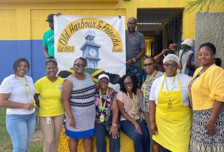 Members of the Old Harbour and Friends Association (OHFA) pause for a photo opportunity at a recent education and health fair staged by the Association, at the Old Harbour Primary School in St. Catherine.

