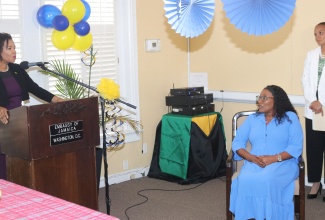 Jamaica’s Ambassador to the United States, Her Excellency Audrey Marks (left), pays tribute to outgoing accountant at the Embassy of Jamaica in Washington DC, Georgette Smith (seated), for her outstanding service at the Mission. The occasion was a farewell reception for Ms. Smith at the Embassy on August 22. Ms. Smith was also hailed for her over 30 years of service to the Ministry of Foreign Affairs and Foreign Trade.