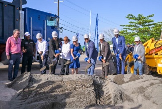 Prime Minister, the Most Hon. Andrew Holness (fourth right), and Factories Corporation of Jamaica Chairman, Lyttleton Shirley (third right), lead the breaking of ground for the Boundbrook Urban Centre in Portland on Wednesday (August 14). They are joined by Minister of Science, Energy, Telecommunications and Transport and Member of Parliament (MP) for Portland Western, Hon. Daryl Vaz (left); Minister of Industry, Investment and Commerce, Hon. Aubyn Hill (second left); and Portland Eastern MP, Ann-Marie Vaz (fifth right), along with other stakeholders.

