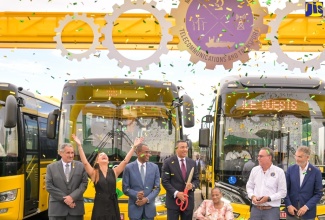 Prime Minister, the Most Hon. Andrew Holness (centre); Minister of Finance and the Public Service, Dr. the Hon. Nigel Clarke (third left); and Minister of Science, Energy, Telecommunications and Transport, Hon. Daryl Vaz (third right), celebrate the addition of 100 new compressed natural gas (CNG) buses to the Jamaica Urban Transit Company (JUTC) fleet, at the recent handover ceremony at the Portmore Depot, in St. Catherine. Sharing the moment are (from left): JUTC Managing Director, Paul Abrahams; Member of Parliament, Portland Eastern, Ann-Marie Vaz; President, Combined Disabilities Association, Christine Keene; and JUTC Chairman, Russell Hadeed.