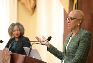 Minister of Education and Youth, Hon. Fayval Williams (right), addresses Wednesday’s (August 28) post-Cabinet press briefing at Jamaica House. Looking on is Minister without Portfolio in the Office of the Prime Minister with Responsibility for Information, Skills and Digital Transformation, Senator Dr. the Hon. Dana Morris Dixon.

