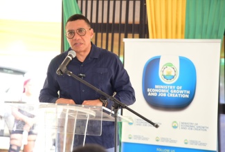 Prime Minister, Dr. the Most Hon. Andrew Holness, delivers the main address at the contract -and ground-breaking ceremony for the Spicy Grove Infrastructure Works Project in Oracabessa, St. Mary, on September 25.

