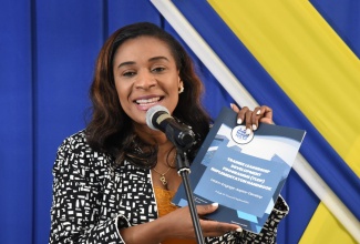 Executive Director of the HEART/NSTA Trust, Dr. Taneisha Ingleton, addresses the launch of the Trust