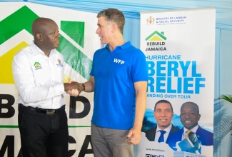 Minister of Labour and Social Security, Hon. Pearnel Charles Jr. (left), greets Head of the World Food Programme (WFP) Caribbean Multi-Country Jamaica Office, Dana Sacchetti, during a ‘Rebuild Jamaica’ handover ceremony in Port Maria, St. Mary, on September 6.

