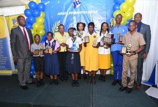 Chief Executive Officer of the Jamaica Information Service (JIS), Enthrose Campbell (fourth left); Director of Corporate Services at the JIS, Errol Gardner (left) and Director of Human Resources at the JIS, Dr. David Knight, celebrate with the JIS Heritage Competition 2023 winners representing (from left) Bright Beginnings Education Centre, Richmond Primary and Infant School, Grove Town Primary, York Castle High, José Martí High and Cornwall College.

