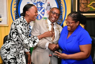 Mayor of Kingston, Councillor Andrew Swaby (centre), enjoys a light moment with Councillor for the Hagley Park Division, Waynette Strachan (left) and Councillor for the Stony Hill Division, Tosha Schwapp, during today’s (September 10) meeting of the Kingston and St. Andrew Municipal Corporation (KSAMC), Marcus Garvey Council Chamber, 24 Church Street, downtown Kingston.