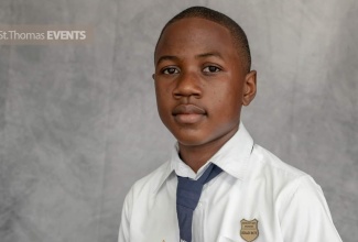 Former Head Boy of Morant Bay Primary School in St. Thomas, Kemuel Brown,  shows off trophies he received for excellent work in academics and extracurricular activities.

