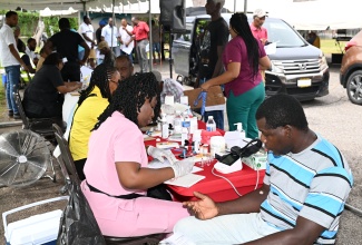 Health workers carry out free health checks during a men’s health fair at Independence Park in Savanna-la-Mar, Westmoreland, on Tuesday (September 24).