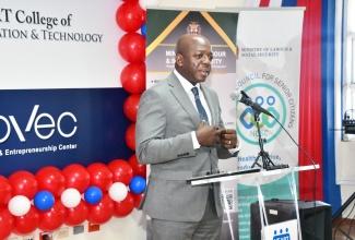 Minister of Labour and Social Security, Hon. Pearnel Charles Jr., addresses the graduation ceremony of the National Council for Senior Citizens (NCSC) Digital Literacy training programme, which was held at the HEART College of Innovation and Technology in St. James, recently.

