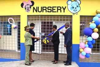 State Minister in the Ministry of National Security, Hon Juliet Cuthbert-Flynn (second right), is assisted by (from left) Superintendent, South Camp Adult Correctional Centre, Joycelyn Roach Spencer; Permanent Secretary in the Ministry, Ambassador Alison Stone Roofe; and Commissioner of Corrections, Brigadier (Ret