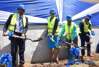 Education and Youth Minister, Hon. Fayval Williams (second left), breaks ground for the construction of the Overseas Examinations Commission (OEC) new state-of-the-art multipurpose facility, on Wednesday (September 18), at the Commission's Manhattan Road location in Kingston. Also taking part (from left) are Chairman of the OEC, Brian Bennett-Easy; Executive Director of the OEC, Hector Stephenson; and Mayor of Kingston, and Councillor for the Vineyard Town Division, Andrew Swaby.

