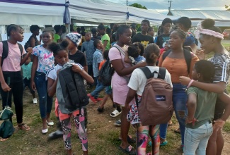 A section of the large crowd that attended a recent back-to-school treat, held at the Independence City Community Centre in Portmore, which was organised by Member of Parliament for St. Catherine South Eastern, Robert Miller.