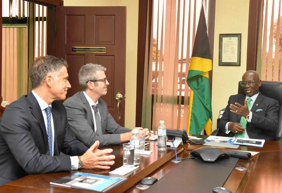 Minister of Local Government and Community Development, Hon. Desmond McKenzie (right), addresses a meeting with World Food Programme (WFP) executives on Tuesday (September 17) at the Ministry’s Hagley Park Road offices in Kingston. Listening are WFP Representative and Country Director, Brian Bogart (centre); and WFP Head of Jamaica Satellite Office, Dana Sacchetti.
