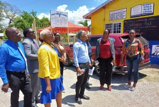 Principal of Alley Primary School in Clarendon, Judith Richards (third left), and Chairman, Junior Maragh (fourth right), are accompanied by senior personnel from the Ministry of Education and Youth, and other officials of the institution in viewing a newly built roof at the school on Tuesday (September 3). The new roof replaces the previous structure, which was severely damaged during Hurricane Beryl’s passage, just south of Jamaica, on July 3.

