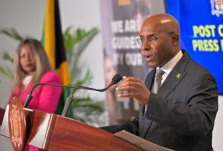 Minister of Industry, Investment and Commerce, Senator the Hon. Aubyn Hill, addressing Wednesday’s (September 18) post-Cabinet press briefing at the corporate office of business processing outsourcing firm iTel, in St. Andrew. Listening is Minister without Portfolio in the Office of the Prime Minister, with Responsibility for Information, Skills and Digital Transformation, Senator Dr. the Hon. Dana Morris Dixon.
