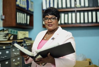 Senior Photo Librarian, Maxine Juliet Shrouder, recipient of the Badge of Honour for Long and Faithful Service, for four decades of work in the field of communication and media.

