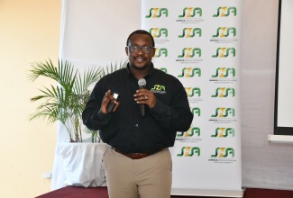 Senior Director, Regulations, Policy Monitoring and Enforcement, Jamaica Special Economic Zone Authority (JSEZA), Ainsley Brown, addresses the organisation’s ‘Unplugged’ Workshop, at Hotel Grand A View in Montego Bay, St. James, on October 9.