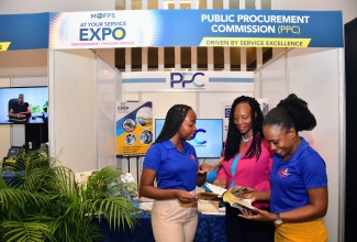 Statistical Institute of Jamaica (STATIN) Senior Communications Officer, Ashley Archer-Gooden (left) and Senior Information Research Officer, Sasha-Gaye Fraser (right), interact with Public Relations and Public Education Officer, Public Procurement Commission, Erica James-King, during the Ministry of Finance and the Public Service’s ‘At Your Service’ Expo at the AC Hotel by Marriott Kingston on Wednesday (October 9).

