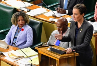 Minister of Foreign Affairs and Foreign Trade, Senator the Hon. Kamina Johnson Smith (right), addresses Friday’s (October 11) sitting of the Senate. Listening (from left) are Minister without Portfolio in the Office of the Prime Minister with Responsibility for Information, Skills and Digital Transformation, Senator Dr. the Hon. Dana Morris Dixon, and Minister of Industry, Investment and Commerce, Senator the Hon. Aubyn Hill.