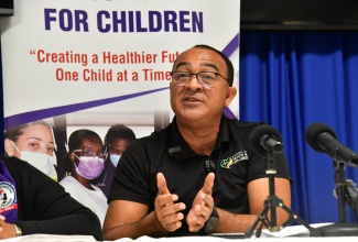 Minister of Health and Wellness, Dr. the Hon. Christopher Tufton, addresses journalists during a media briefing at the Bustamante Hospital for Children in Kingston on Thursday (October 24), to provide an update on support being extended to an 11-year-old girl ailing from scoliosis who requires surgery.

