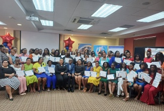 Early-childhood educators who participated in a recent literacy intervention project, dubbed ‘Read Right from the Start’, geared at delivering improved outcomes for children at early-childhood institutions, are pictured with officials, at the recent graduation ceremony, held at the University of the West Indies (UWI) Regional Headquarters in St. Andrew.

