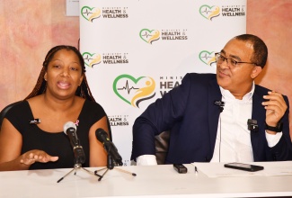 Minister of Health and Wellness, Dr. the Hon Christopher Tufton (right), listens as beneficiary under the Jamaica-Cuba Eye Care Programme, Zoya Kidd, shares her experience, during a tour of the St. Joseph’s Hospital in St. Andrew on Tuesday (October 29).

