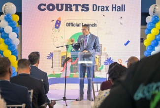 Prime Minister, Dr. the Most Hon. Andrew Holness, addresses the opening of a new Courts store in Drax Hall, St. Ann, on October 10.   

