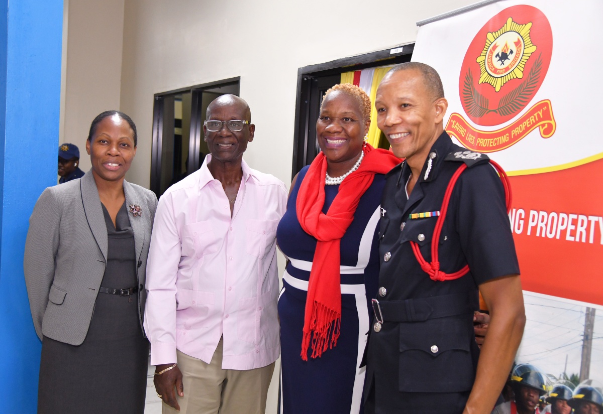 Minister of Local Government and Community Development, Hon. Desmond McKenzie (second left), shares a photo opportunity with (from left) Permanent Secretary in the Ministry, Marsha Martin Henry; Senior Lecturer, University of Technology Jamaica (UTech), Dr. Nadine Maitland; and Commissioner, Jamaica Fire Brigade (JFB), Stewart Beckford, during the media launch for the JFB’s Fire and Life Safety Awareness Week. The launch was held at the Ministry’s offices in St. Andrew on Wednesday (October 23). The week is being observed from October 27 to November 3 under the theme ‘Embracing Digital Innovation to Improve Fire Safety’.
