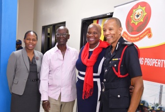 Minister of Local Government and Community Development, Hon. Desmond McKenzie (second left), shares a photo opportunity with (from left) Permanent Secretary in the Ministry, Marsha Martin Henry; Senior Lecturer, University of Technology Jamaica (UTech), Dr. Nadine Maitland; and Commissioner, Jamaica Fire Brigade (JFB), Stewart Beckford, during the media launch for the JFB’s Fire and Life Safety Awareness Week. The launch was held at the Ministry’s offices in St. Andrew on Wednesday (October 23). The week is being observed from October 27 to November 3 under the theme ‘Embracing Digital Innovation to Improve Fire Safety’.

