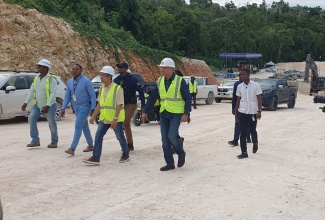 Prime Minister, Dr. the Most Hon. Andrew Holness (right), tours a section of the Montego Bay Perimeter Road Project in St. James on October 16. Also on the tour was Deputy Prime Minister and Minister of National Security, Hon. Dr. Horace Chang (second right), who is Member of Parliament for St. James North Western.

