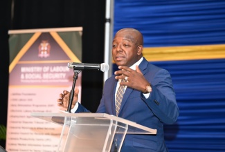 Minister of Labour and Social Security, Hon Pearnel Charles Jr,. addresses a Job Recruitment Fair at the Montego Bay Convention Centre, St. James, on September 18.

