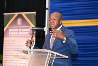 Minister of Labour and Social Security, Hon Pearnel Charles Jr,. addresses a Job Recruitment Fair at the Montego Bay Convention Centre, St. James, on September 18.
