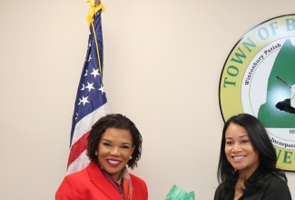 Ambassador to the United States, Her Excellency Audrey Marks, presents Bloomfield Mayor, Danielle C. Wong, with a package of premium Jamaican Blue Mountain Coffee, during a recent visit to the town in Connecticut. 