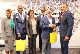 Health and Wellness Minister, Dr. the Hon. Christopher Tufton (right), makes a presentation to President of Hartford HealthCare Corporation, Dr. Jeffrey Flaks, following a meeting at the company’s headquarters in Hartford, Connecticut, on November 1. Sharing the moment (from left) are Regional President of Hartford HealthCare, Gina Calder; Vice President, Hartford HealthCare, Keith Grant; Jamaica's Ambassador to the United States, Her Excellency Audrey Marks; and University of the West Indies (UWI) Professor, Dr Marvin Reid.