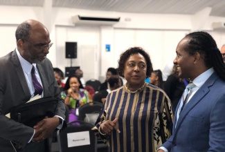 Minister of Culture, Gender, Entertainment and Sport, Hon. Olivia Grange, converses with Minister of State in the Ministry of Foreign Affairs and Foreign Trade, Hon. Alando Terrelonge (right), and Chairman of the Electoral Commission of Jamaica, Earl Jarrett, during the opening ceremony for the Organization of American States (OAS) Electoral Observation Missions workshop on women’s political participation, at the S Hotel in Kingston on Monday (November 18).

