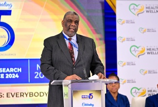 Permanent Secretary in the Ministry of Health and Wellness, Errol Greene, delivers remarks on behalf of Portfolio Minister,  Dr. the Hon. Christopher Tufton, during the opening ceremony for the 15th staging of the National Health Research Conference on Wednesday (November 20) at the Jamaica Pegasus Hotel in New Kingston.