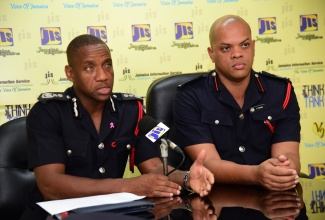 Jamaica Fire Brigade (JFB) Deputy Commissioner, Sean Martin (left), discusses fire safety during a recent Jamaica Information Service (JIS) ‘Think Tank’ at the agency’s head office in Kingston. Listening is JFB Superintendent, Emeleo Ebanks.

