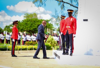 Custos Rotulorum for St. Andrew, Hon. Ian Forbes, representing Governor-General, His Excellency the Most Hon. Sir Patrick Allen, lays a wreath at the Cenotaph honouring those who gave their lives in the two great wars. The occasion was the annual Remembrance Day Parade on Monday (November 11) at National Heroes Park in Kingston. 