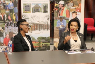 Jamaica’s Ambassador to the United States (US), Her Excellency Audrey Marks (right), addresses members of the of the Windsor Town Council during a recent visit to the town near Hartford, Connecticut. Listening is Mayor of Windsor, Nuchette Black-Burke.

