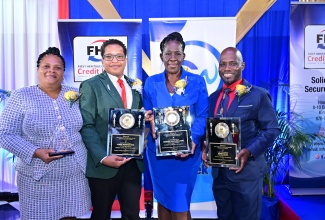 Andre Allen (right), Manager for Computer Services, Jamaica Information Service copped the Civil Servant of the Year Award in the Managerial Category, Barbara Williams Riley (2nd right), Field Supervisor, Statistical Institute of Jamaica copped the Mid Managerial Award and Jeron Bonsfeather (2nd left), Psychiatric Nursing Aide, Ministry of Health and Wellness won in the Technical Support Category. Veronica Miller Richards (left), Regional Health Records Administrator, Ministry of Health and Wellness copped the People’s Choice Award during the FHCCU/CSW Civil Servants of the Year and People’s Choice Awards at the Terra Nova All-Suite Hotel on Friday, November 15, 2024.