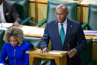 Minister of Industry, Investment and Commerce, Senator the Hon. Aubyn Hill, pilots the Financial Services Commission (Amendment) Act, 2024 in the Senate on November 1. At left is Minister of Education, Skills, Youth and Information, Senator Dr. the Hon. Dana Morris Dixon.