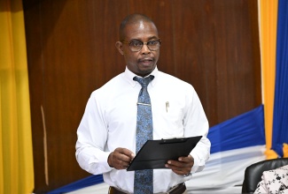 Chief Public Health Inspector for St. Ann, Leroy Scott, addresses the St. Ann Municipal Corporation’s monthly meeting in St. Ann’s Bay on Thursday (November 14).

