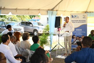 Health and Wellness Minister, Dr. the Hon. Christopher Tufton, addresses an Adopt-a-Clinic ceremony at the Sandy Bay Health Centre in Hanover on November 15.

