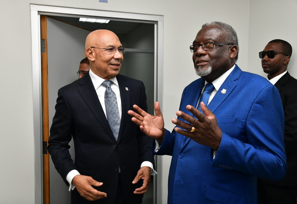 Governor General, His Excellency the Most Hon. Sir Patrick Allen (left), in discussion with Chairman, National Identification Registration Authority (NIRA), Bishop the Hon. Conrad Pitkin. The occasion was Friday’s (November 15) official launch of the NIRA, located at the Central Sorting Office (CSO) in Kingston, where the Governor General enrolled and received his national identification card. 