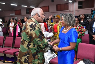 Minister of Education, Skills, Youth and Information, Senator Dr. the Hon. Dana Morris Dixon, is greeted by Pastor of Fellowship Tabernacle in Kingston, Rev. Merrick ‘Al’ Miller, during the Press Association of Jamaica’s (PAJ) 2024 National Journalism Week Church Service on Sunday (November 17). The service was held at Fellowship Tabernacle. National Journalism Week is being observed from November 17-25 under the theme: ‘Media Power: Shaping Democracy or Serving Hidden Agendas?’