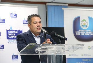 Minister without Portfolio in the Ministry of Economic Growth and Job Creation, Hon. Matthew Samuda, addresses the signing ceremony for the BREDS Loan of Generators for National Water Commission (NWC) Newell and Little Park Facilities, at the Ministry, New Kingston, on November 29. 