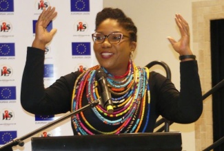 Head of the Institute for Gender and Development Studies (IGDS), Mona Unit, Dr. Dalea Bean, addresses Thursday’s (November 21) launch of the Jamaica AIDS Support for Life (JASL)/European Union (EU) funded project - ‘Promoting Human Rights and Access to Justice for Priority Populations in Jamaica’ - at the Jamaica Pegasus Hotel in New Kingston.